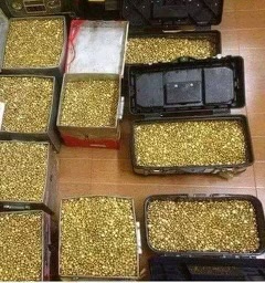 Refined gold bars and granules packed in cases